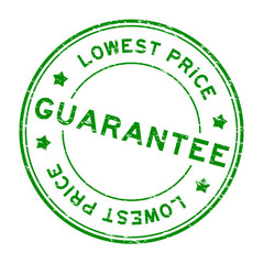 Grunge green guarantee lowest price round rubber seal stamp on white background