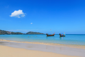 Landscape of long tail boats on Karon and Kata Beaches with blue sky background at  Phuket, Thailand.