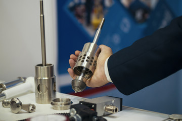 Men shoes metal detail on chemistry exhibition - part of extrusion line