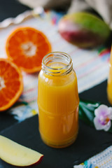 Fresh natural mango and orange fruits smoothie.