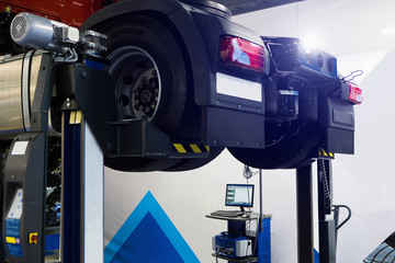 Truck on a column lift in a car service