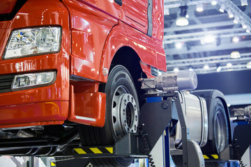 Truck on a column lift in a car service © scharfsinn86