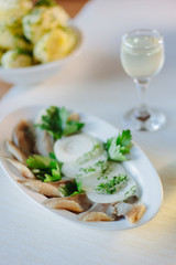 Salty herring on restaurant table.