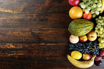 exotic fruits on a wooden background