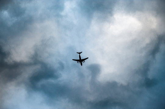 Aircraft Flying Through Clouds In Overcast Bad Weather