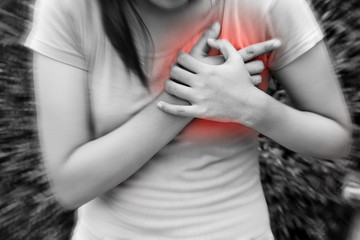 Obraz na płótnie Canvas Sporty woman having heart attack - Angina Pectoris, Myocardial Infarction.