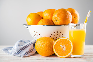 Fresh oranges in a colander