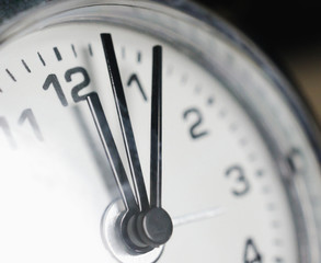 Hands of the clock showing hours, minutes and seconds. Macro.