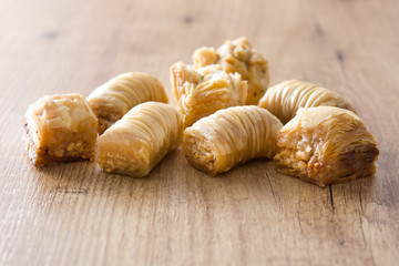 Turkish dessert baklava on wooden table
