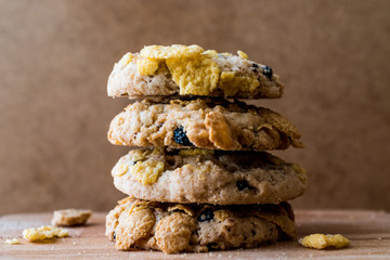 Stack of Cornflake Cookies on wooden surface.