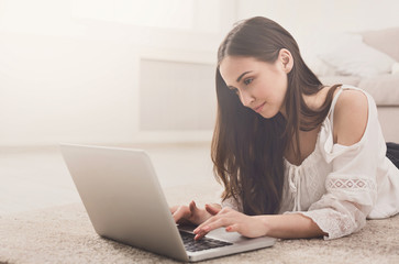 Young girl using laptop