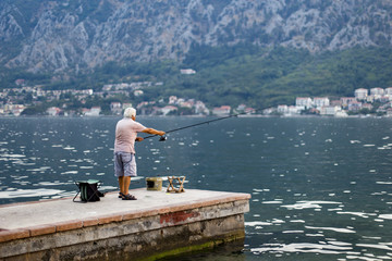 The old man fishes in the sea