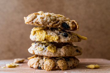 Stack of Cornflake Cookies on wooden surface.