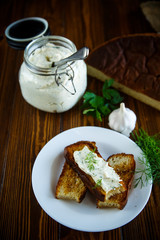 Sandwich of fried toasts with garlic melted cheese