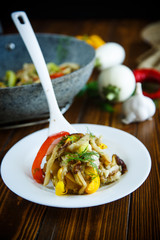 eggplant with vegetables fried in a wok
