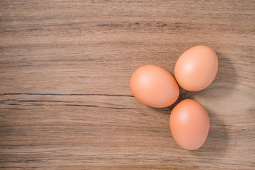 Close up group three of Egg on wooden background, isolated, fresh egg