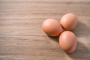 Close up group three of Egg on wooden background, isolated, fresh egg