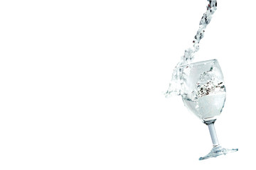 water pouring in glass isolated on white background