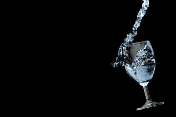 Fototapeta na wymiar water pouring in glass isolated on white background