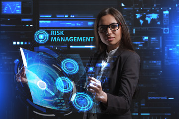 The concept of business, technology, the Internet and the network. A young entrepreneur working on a virtual screen of the future and sees the inscription: Risk management
