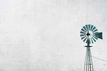 Agriculture windmill with rustic texture background in black and white.