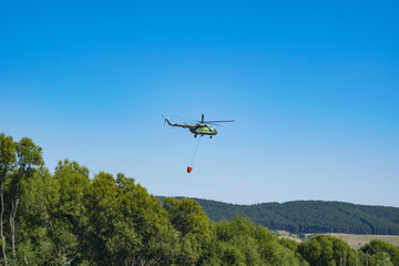 Fototapeta na wymiar Flying helicopter in the air