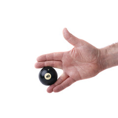 Hand hält Billardkugel - Symbolfoto für spielen