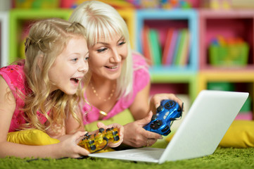 mother and daughter playing game 