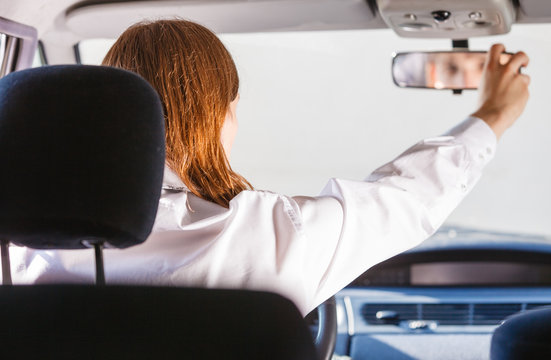 Man In Car Looking At Mirror Inside