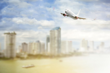 airplane flying above the city