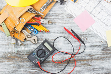 Set of construction tools, drawings and multimeter