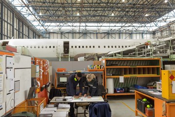 Aircraft maintenance interacting with each other