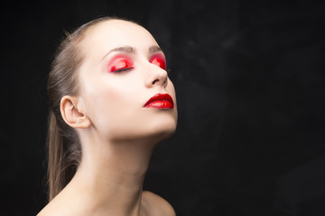 girl with the red eyeshadow covered with gloss