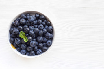 A bowl of blueberries with place for logo