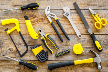 house renovation with implements set for building, painting and repair wooden table background top view