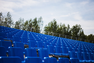 Naklejka premium blue tribunes at the local stadium
