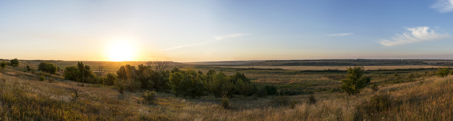 Beautiful sunrise on the hill in August.
