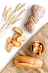 baking fresh wheaten bread on bakery work table background top view