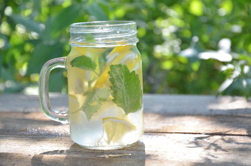 Lemon mojito cocktail with mint lemonade, cold refreshing drink or beverage, ice