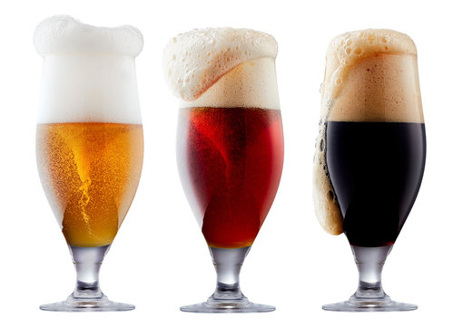 Mug collection of frosty dark red and light beer with foam isolated on a white background