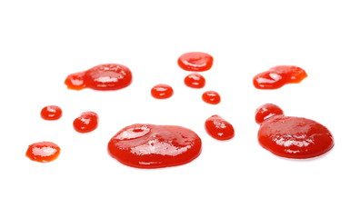Red ketchup splashes isolated on white background, tomato pure texture