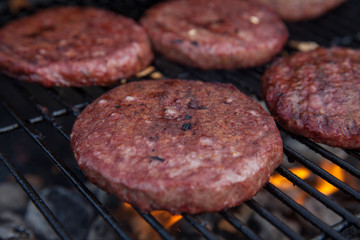 Beef or pork meat barbecue burgers for hamburger prepared grilled on flame grill