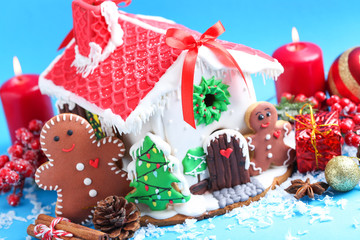 Christmas gingerbread house on blue background