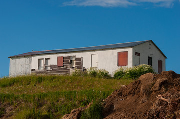Fototapeta na wymiar abandened building on island of Hrisey in Iceland