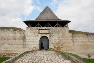 Fototapeta premium Entrance to brick Khotyn town and fort, Ukraine. The castle is located on the right bank of the Dniester River. Built in the 14th century