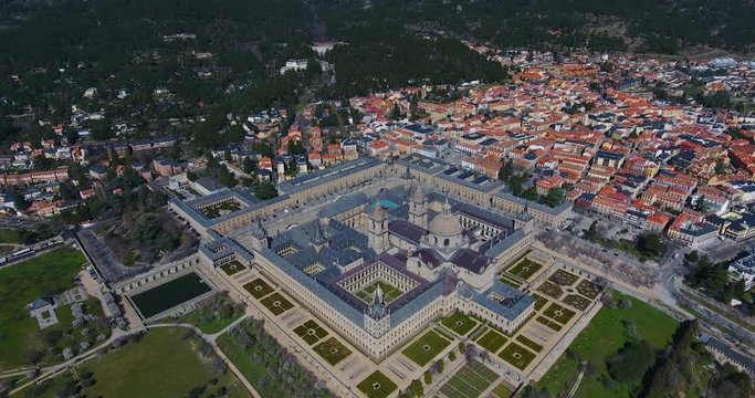 The Royal Seat of San Lorenzo de El Escorial, historical residence of the King of Spain, about 45 kilometers northwest Madrid, in Spain. Amazing aerial view from the top with a wide angle - 1