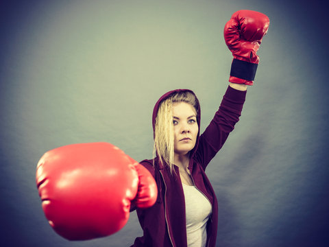 Woman winner wearing boxing gloves