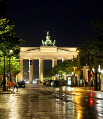 Berlin Germany Brandenburg Gate at night with reflections of lig