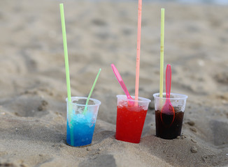 three glasses on the beach