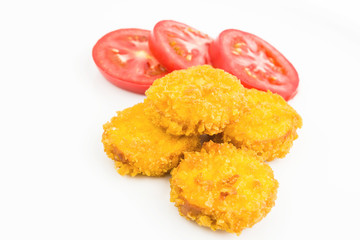 Round Fried Cheese Bites With Corn Flakes And Fresh Sliced Tomato On White Background